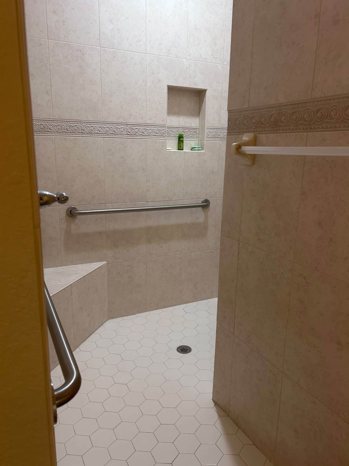 Beige tile walk-in shower